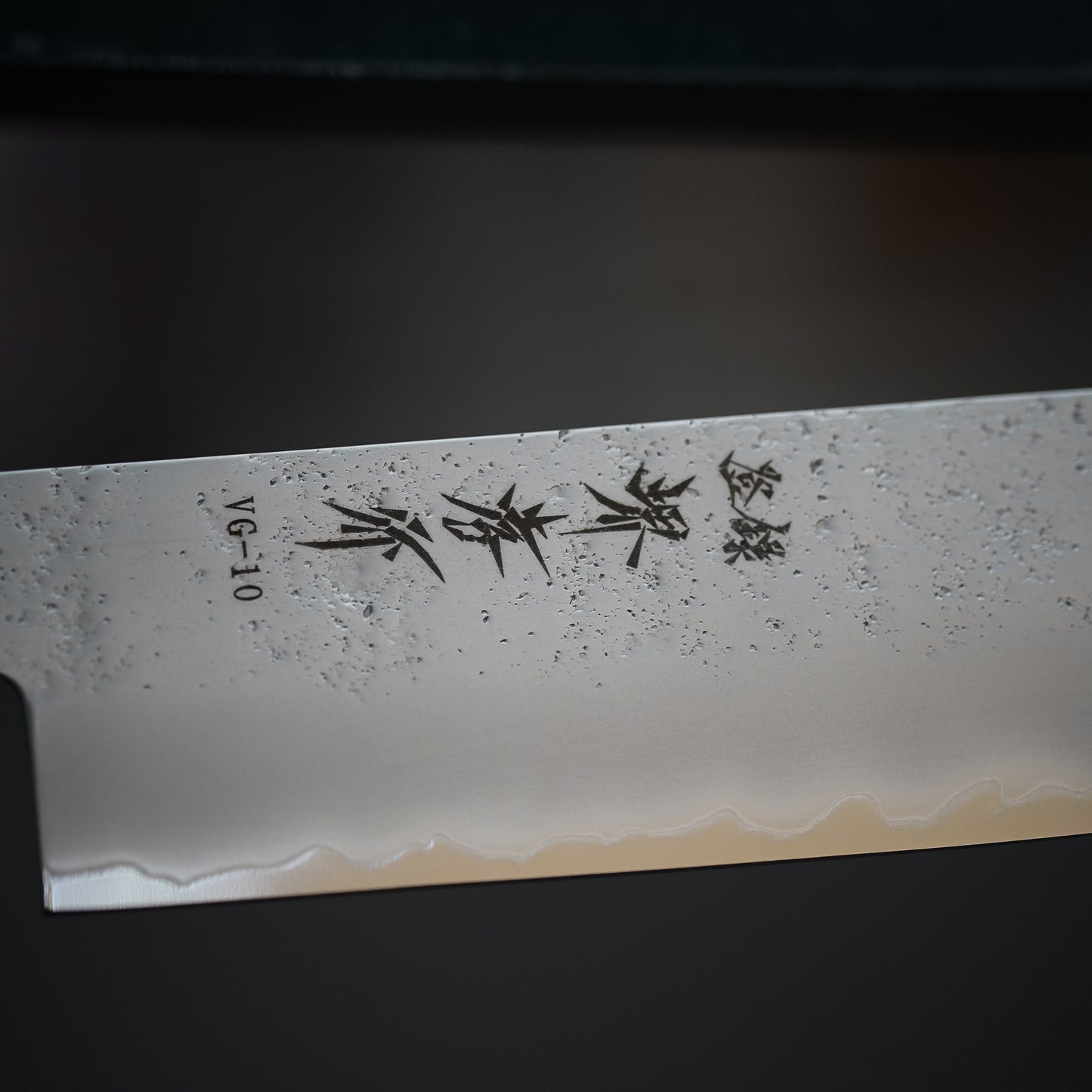 
                  
                    VG10 Nashiji Ebony Handle Sword-Shaped Santoku Knife 160mm / Sakai Takayuki
                  
                
